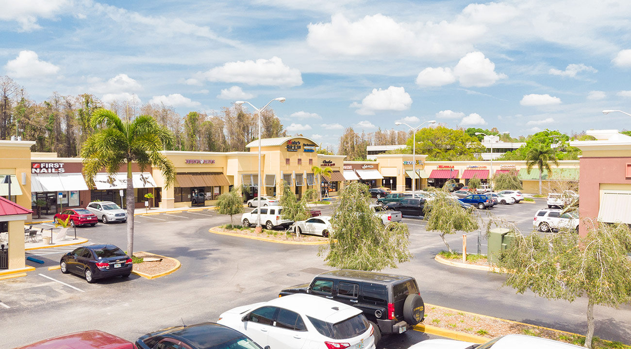 CS17 Colonial Square shopping center exterior with retail storefronts and parking lot in Tampa Florida