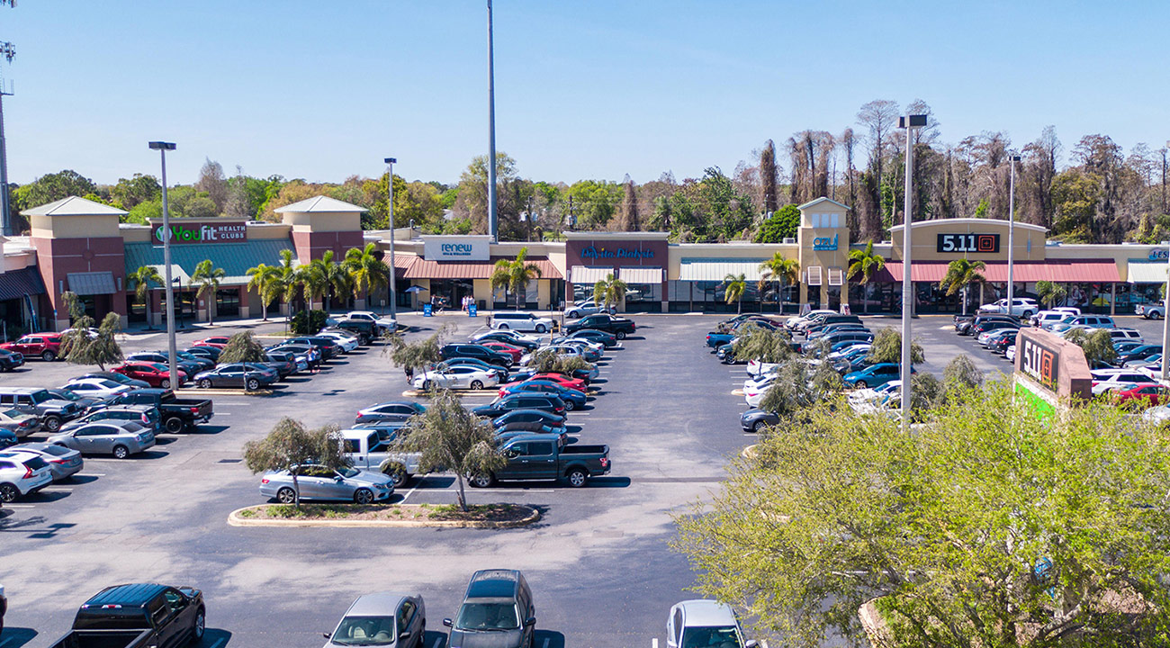 SC6 Wide exterior view of The Shoppes of Carrollwood retail center in Tampa, Florida